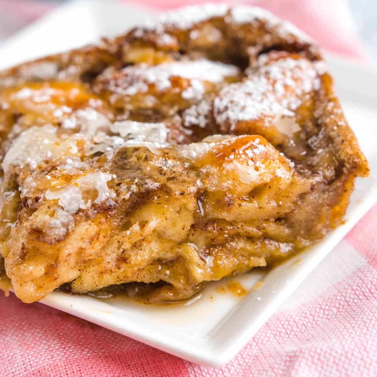 slice of cinnamon roll casserole on plate