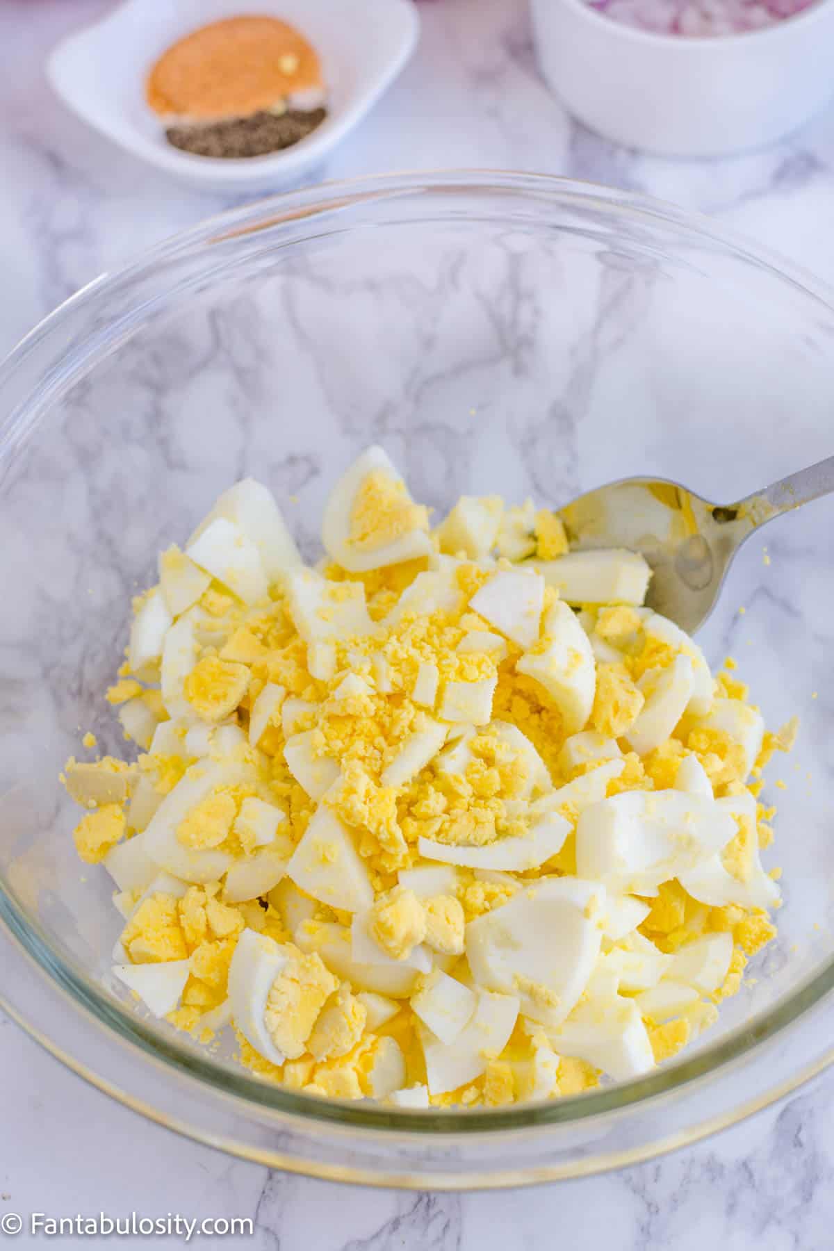 Chopped eggs in mixing bowl