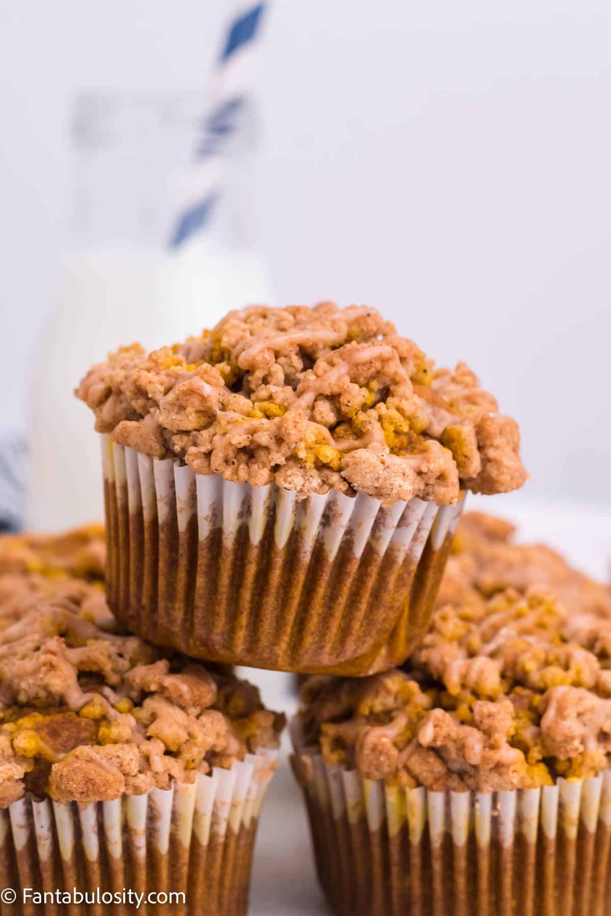 Close up of stacked pumpkin streusel muffins