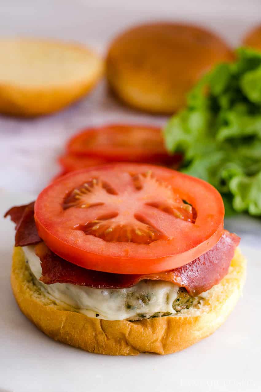 Baked turkey club burger with bacon and tomato