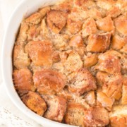 donut bread pudding in a white baking dish