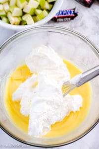 Cool Whip in pudding in bowl.