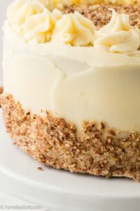 Crushed pecans placed on bottom half of cake.