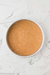Carrot cake batter in cake pan.