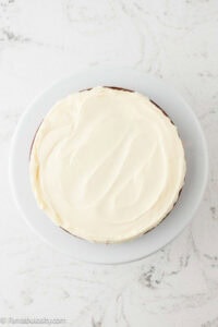 Buttercream frosting on carrot cake.
