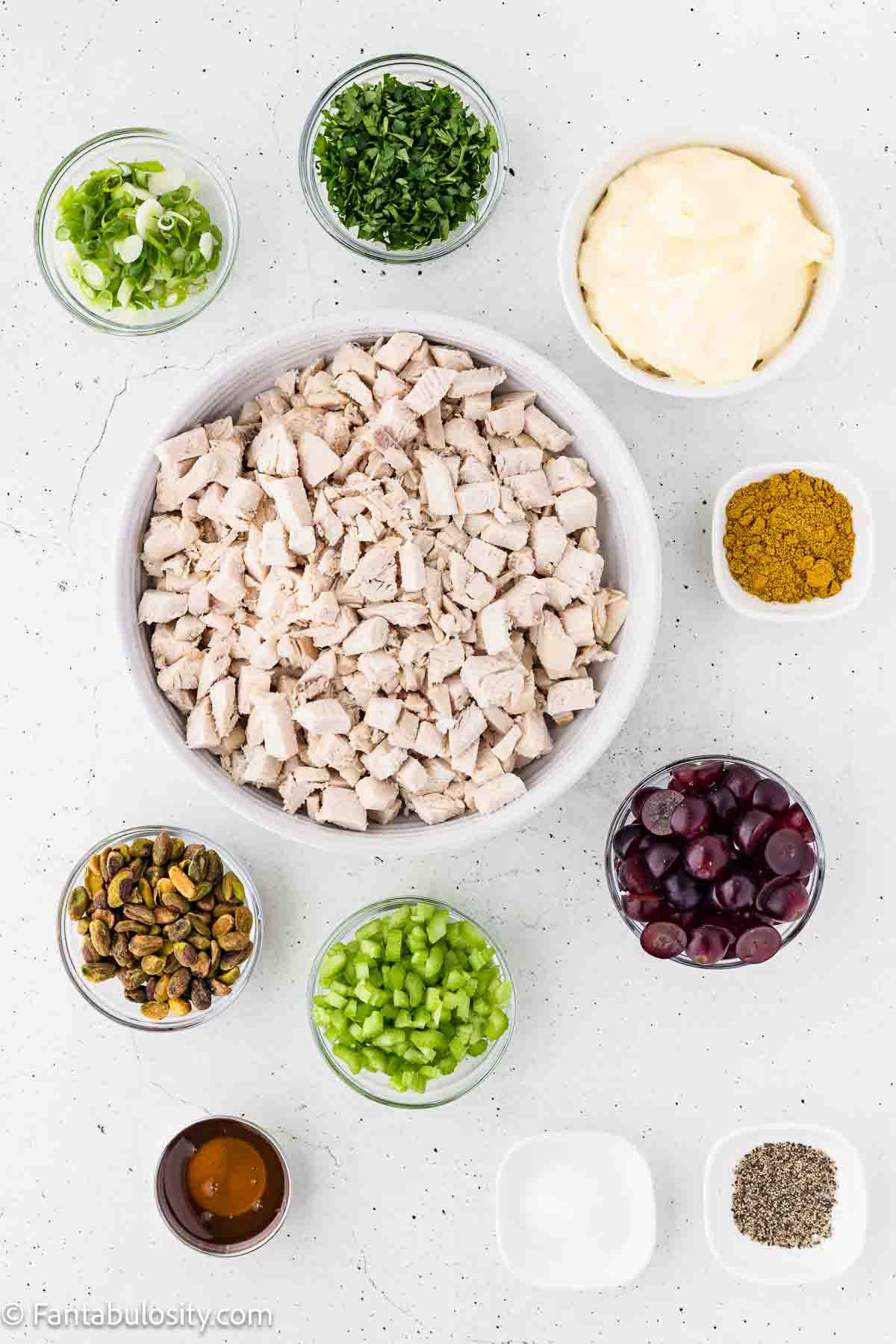 Ingredients to make curry chicken salad on counter. 
