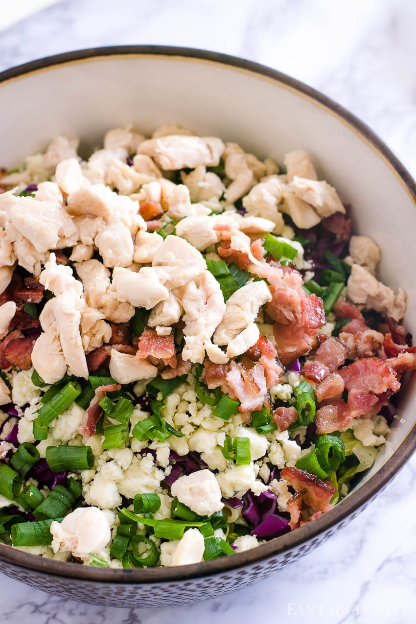 Chopped chicken on top of Italian Chopped Salad