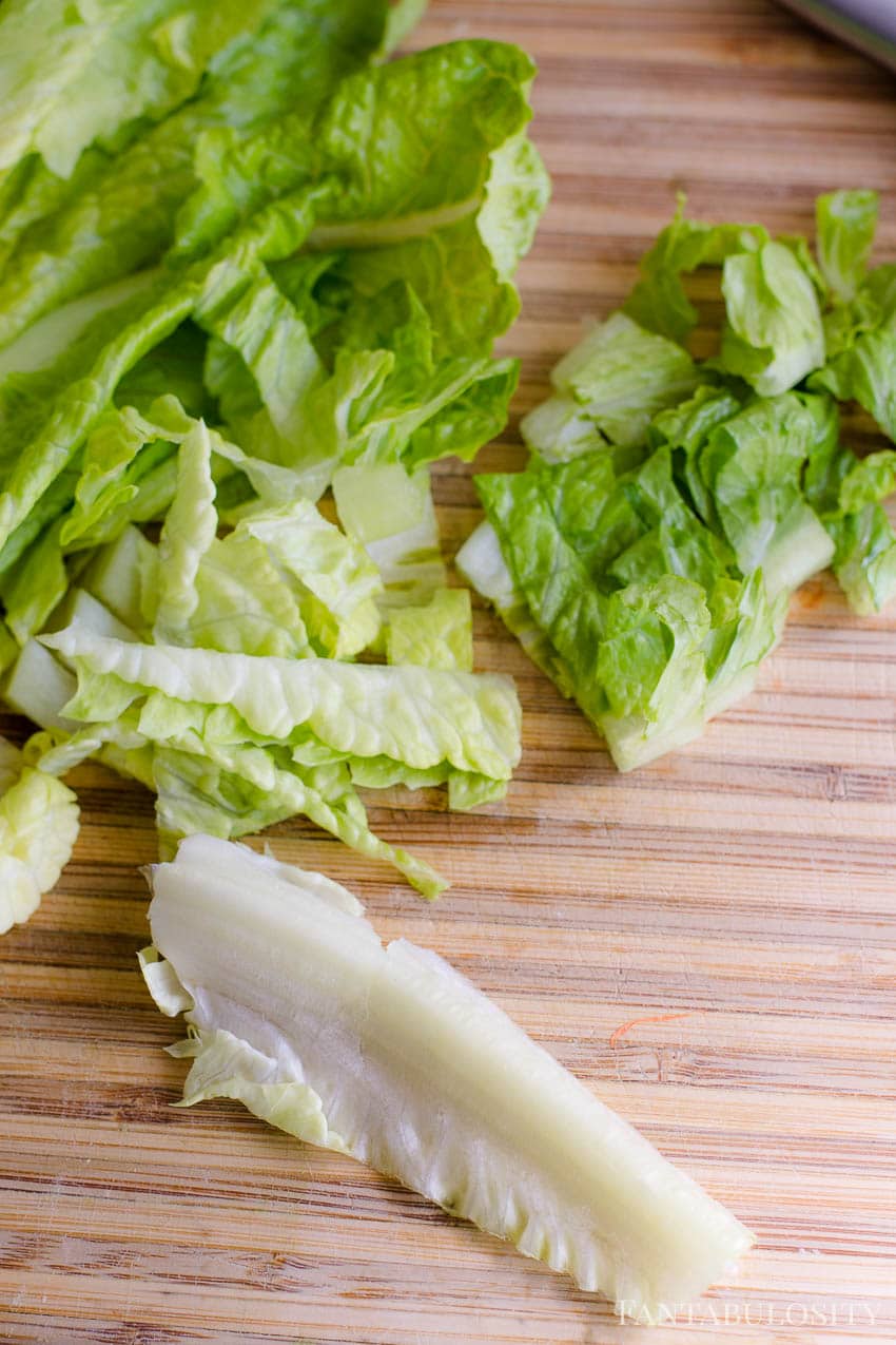 Cut romaine off of stalks - using a cutting board