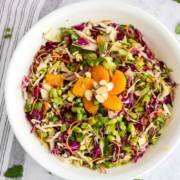 Chopped Asian Salad - in a white bowl with mandarin oranges on top
