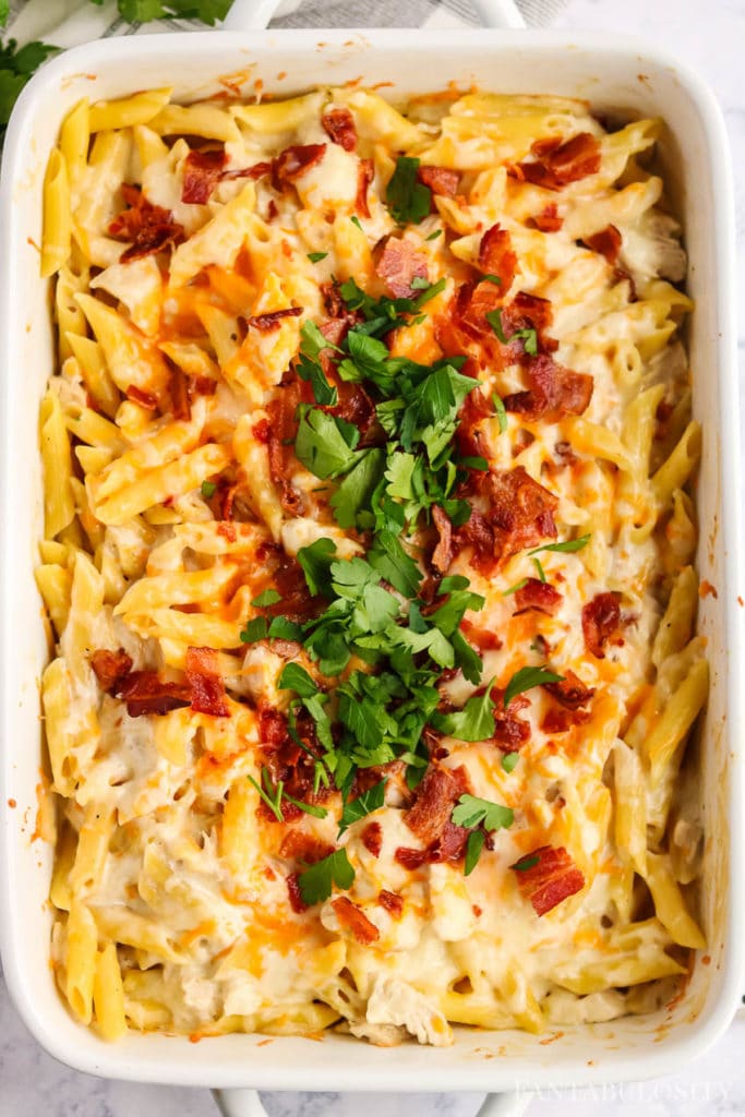 Fresh herbs sprinkled on top of bacon chicken ranch pasta