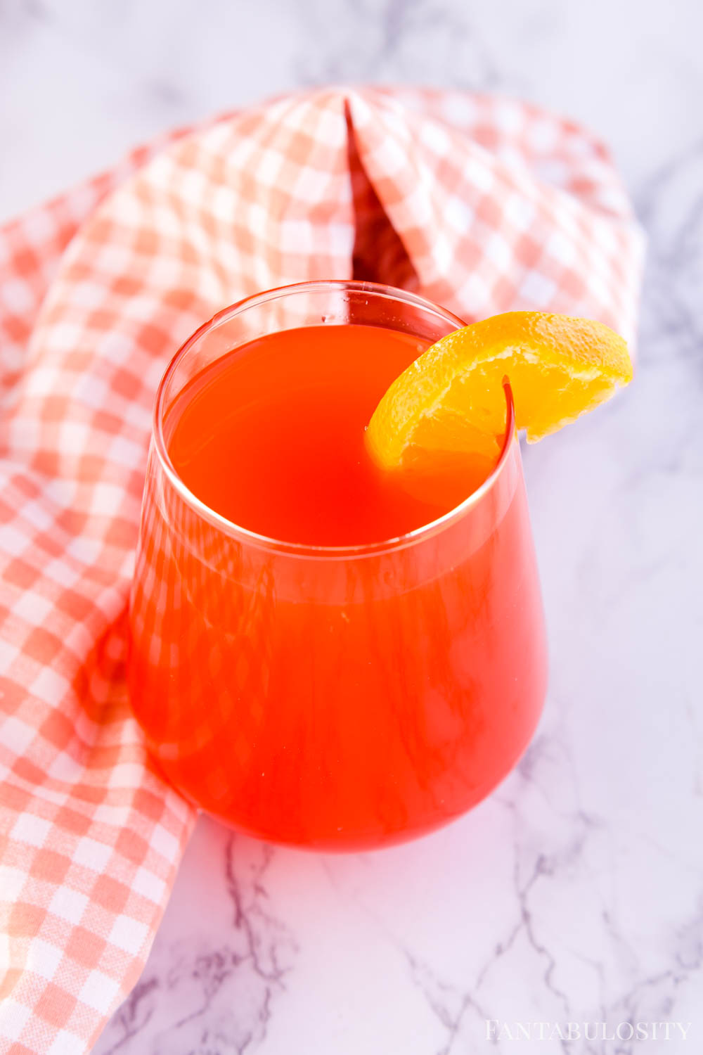 The BEST Fruit Punch Recipe - single serve in a glass with orange slice