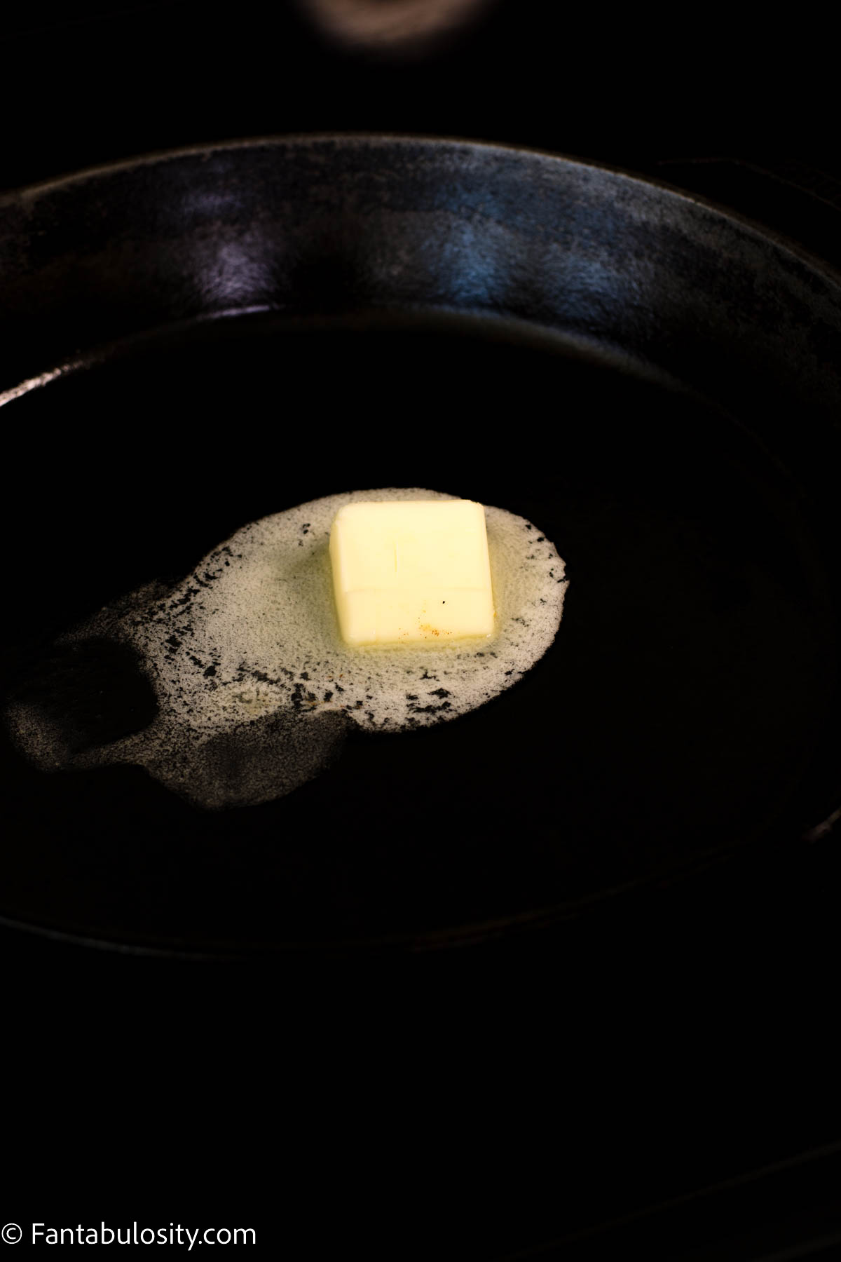 butter melting in hot skillet