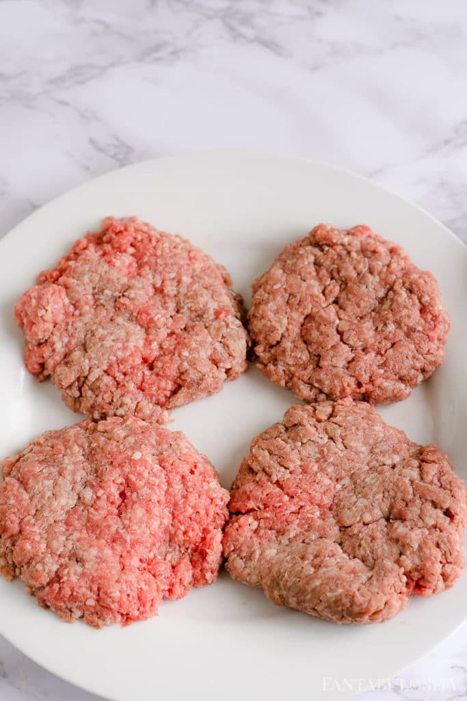 Raw hamburger patties ready to bake