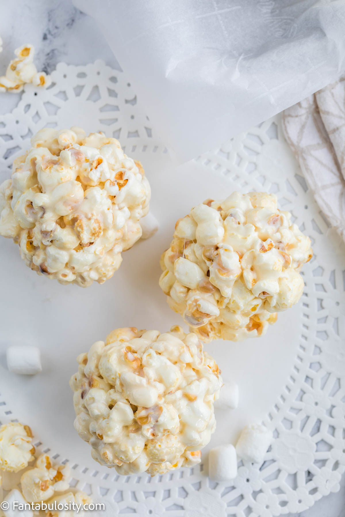 popcorn balls on white table cloth