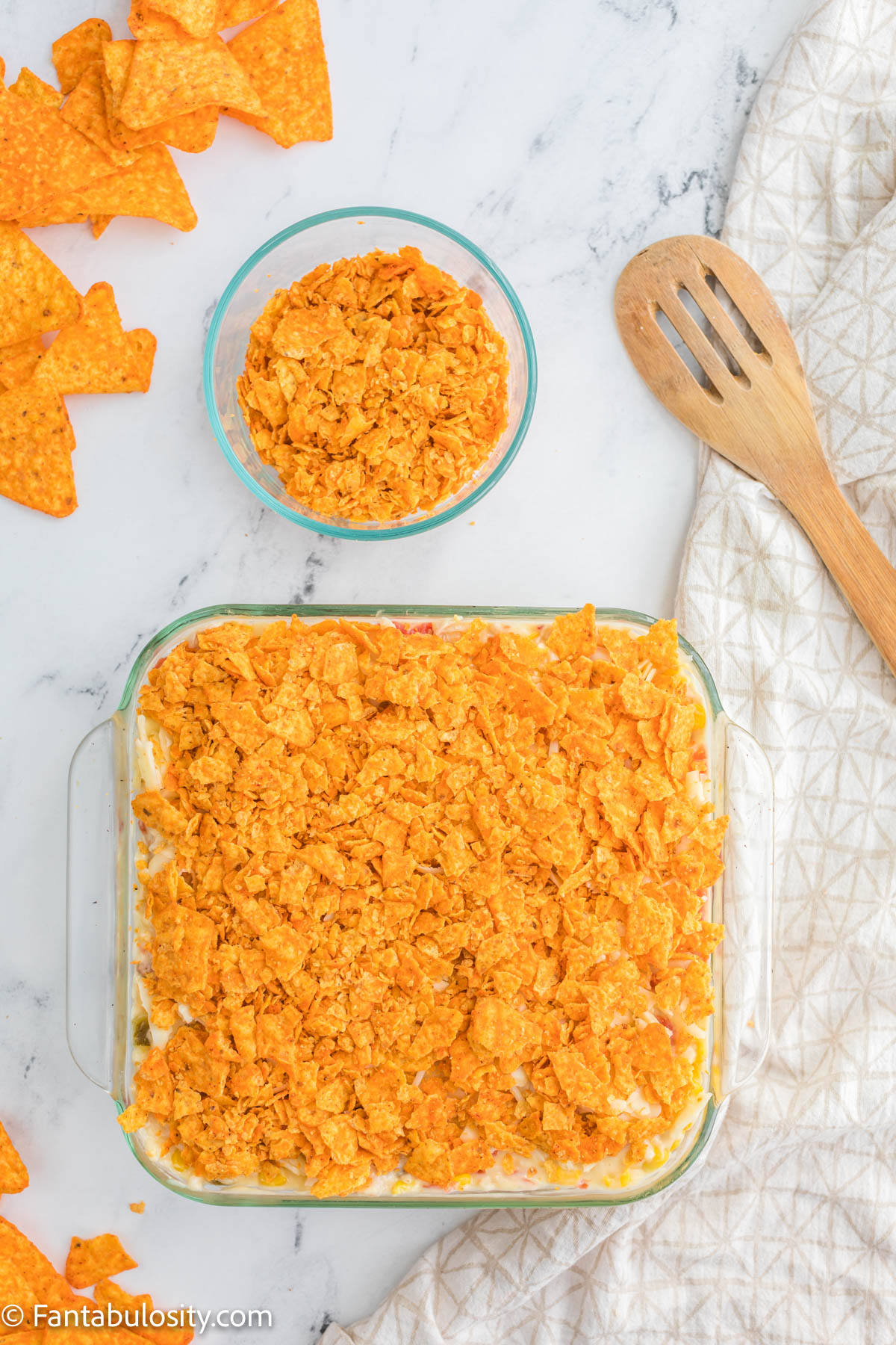 Doritos Chicken Casserole in baking dish ready for oven