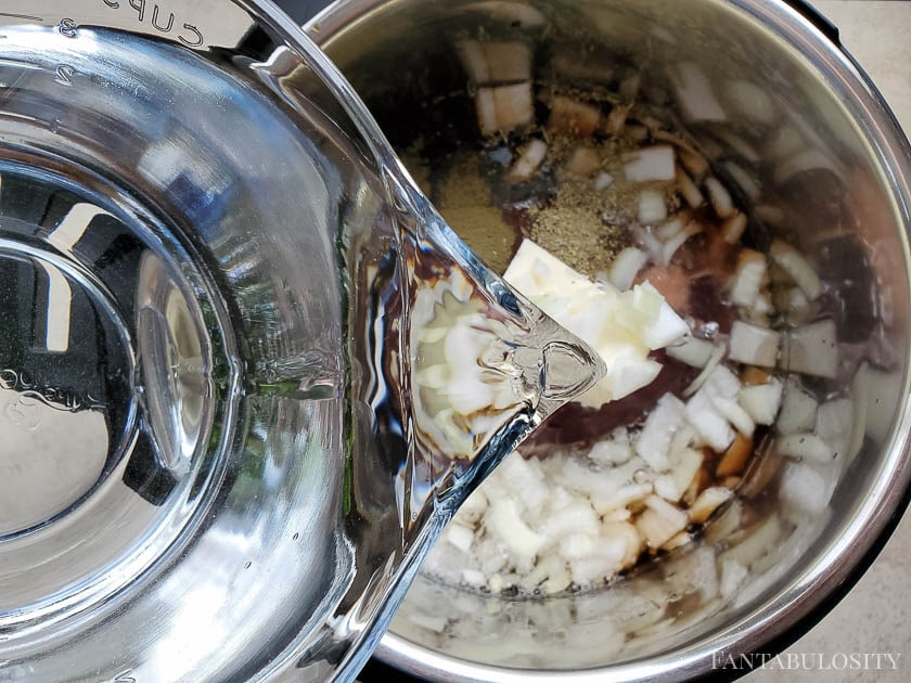 Pouring water in to instant pot for french dip