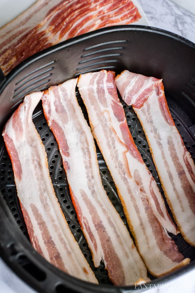 Uncooked raw bacon in air fryer