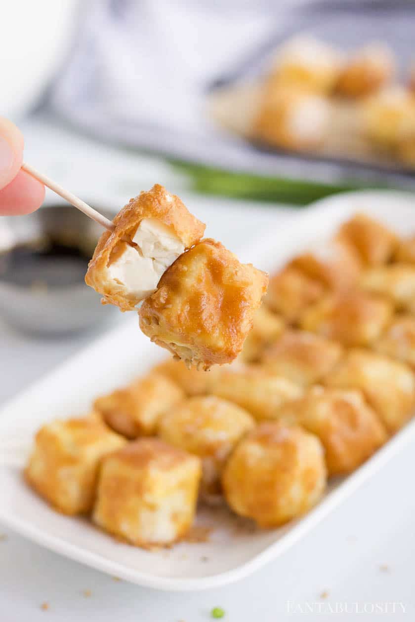 
Crispy tofu on a toothpick.
