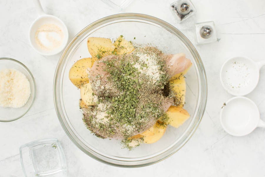 chicken potatoes and herbs in bowl