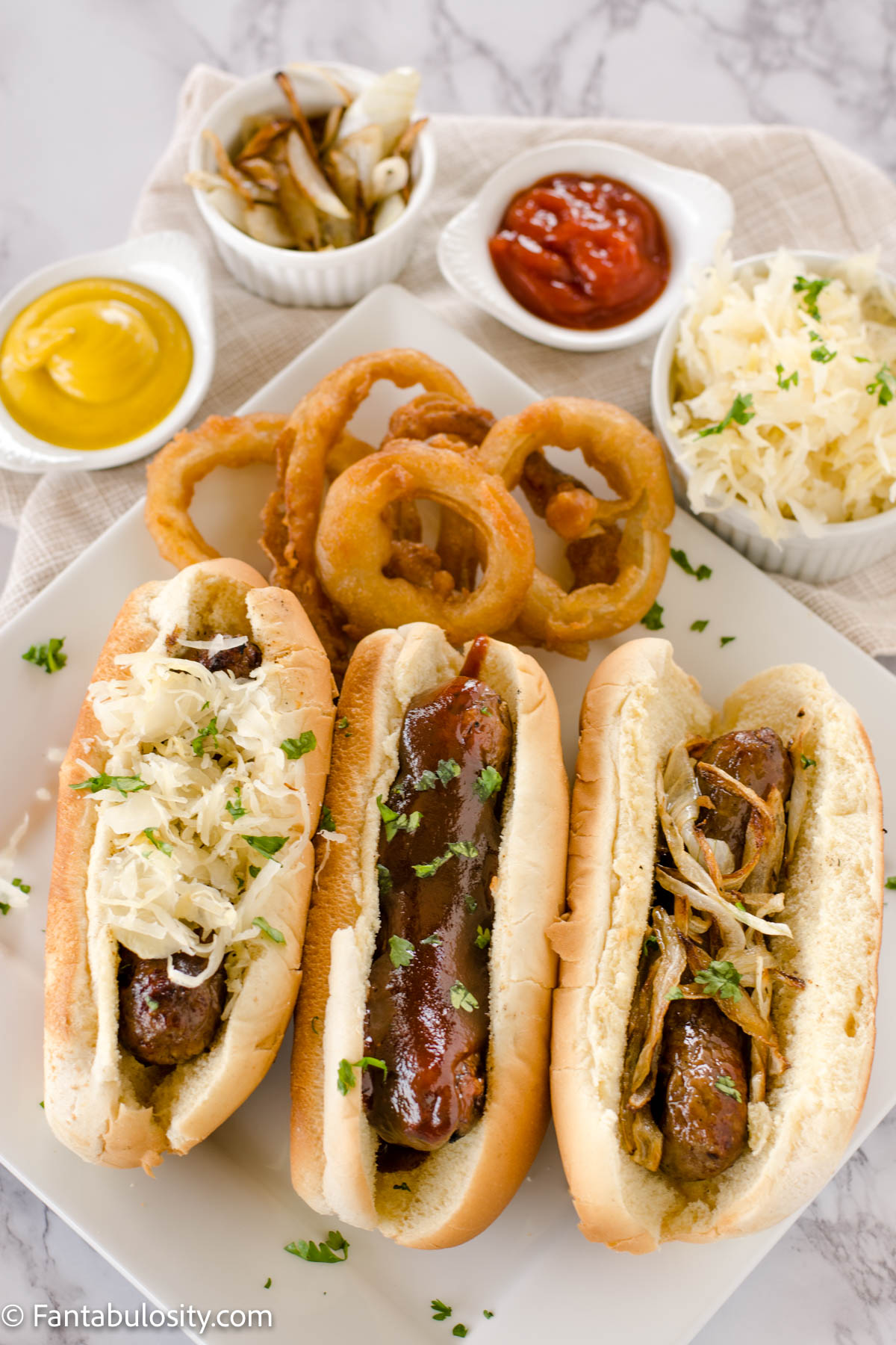 Brats in the Oven with toppings