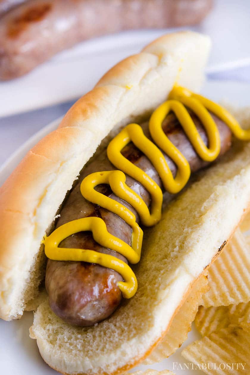 Brats cooked in the Oven and placed on a bun with mustard