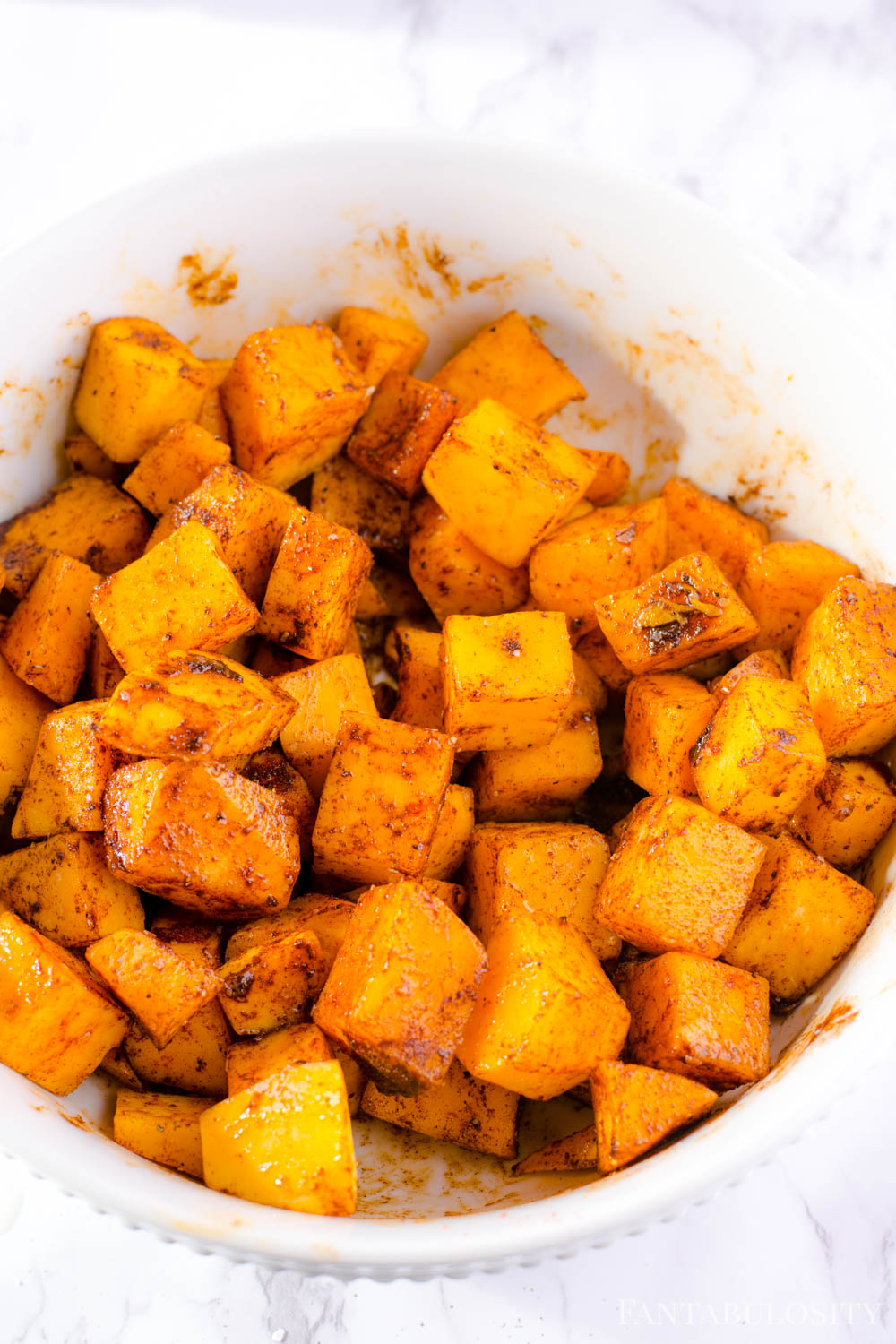 Stir butternut squash is evenly covered with spices