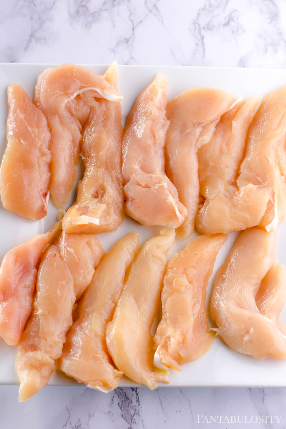 uncooked, raw chicken tenders