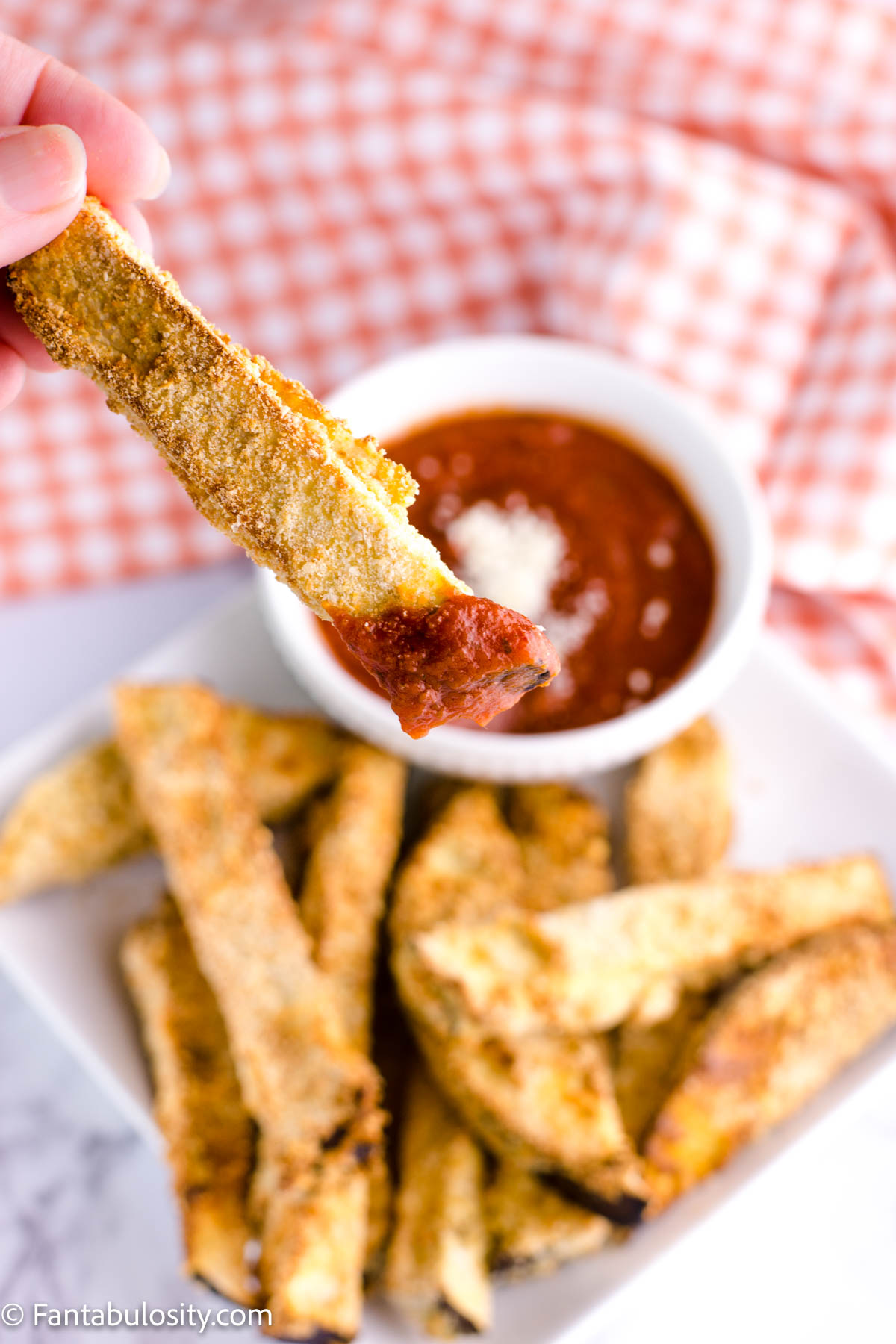 Eggplant fries with red sauce.