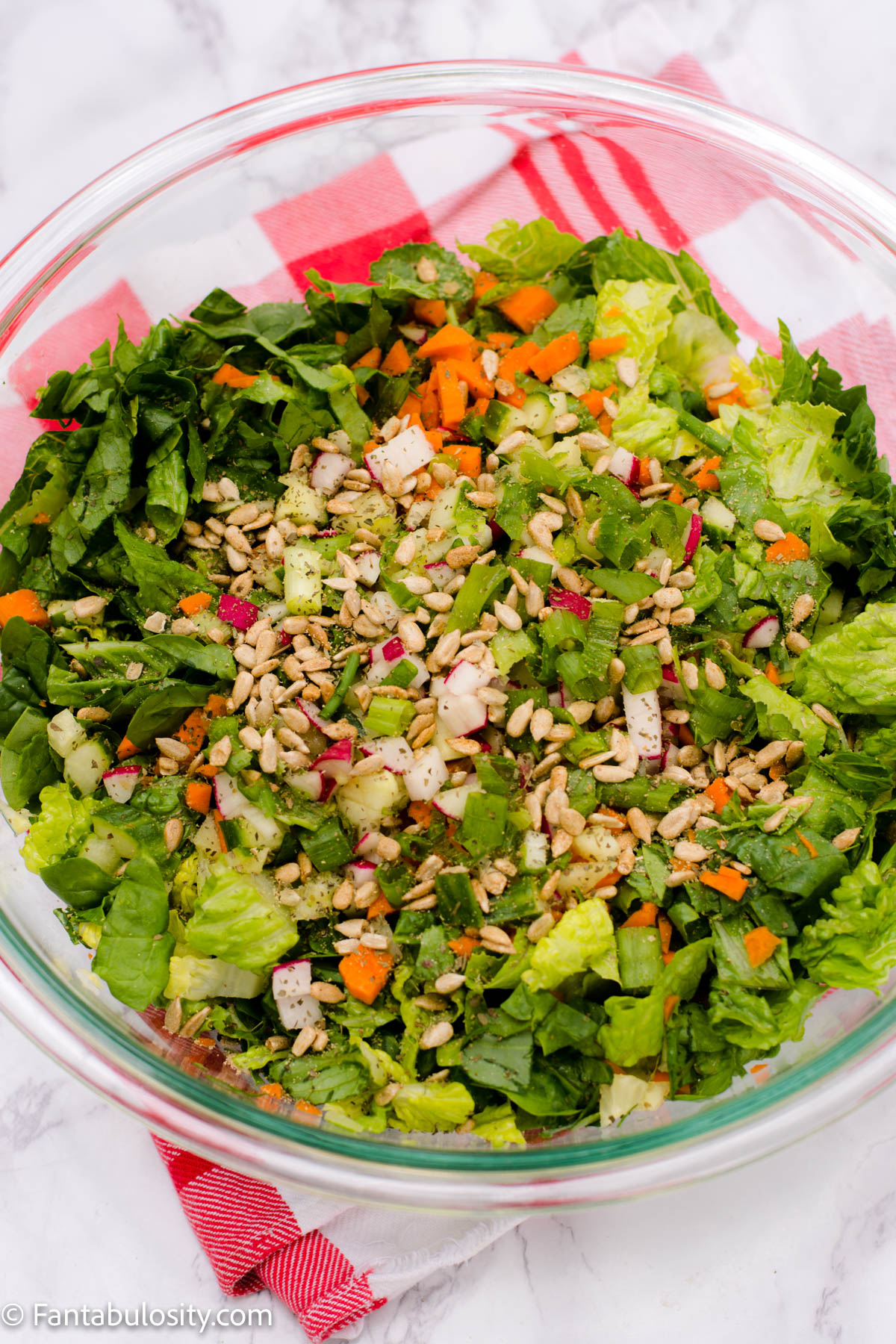 Side salad with toppings in clear bowl