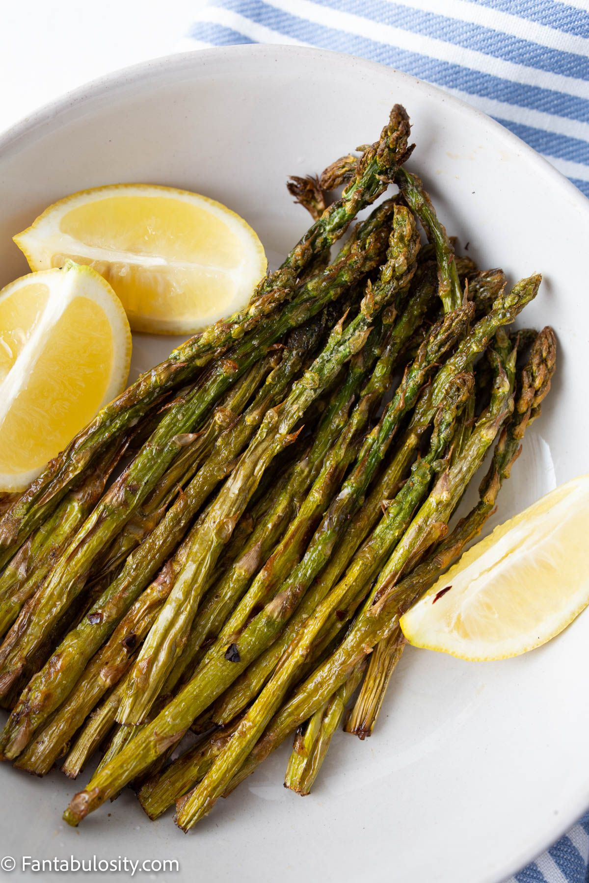 
A plate with crispy air fried asparagus.
