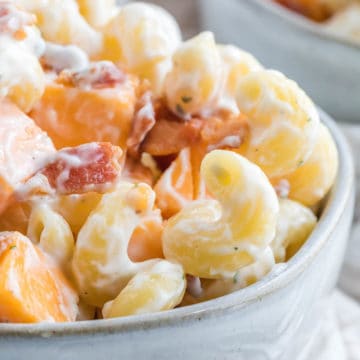 close up of bacon ranch pasta salad in gray bowl