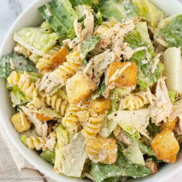Chicken Caesar Pasta Salad in big bowl, sitting on napkin.