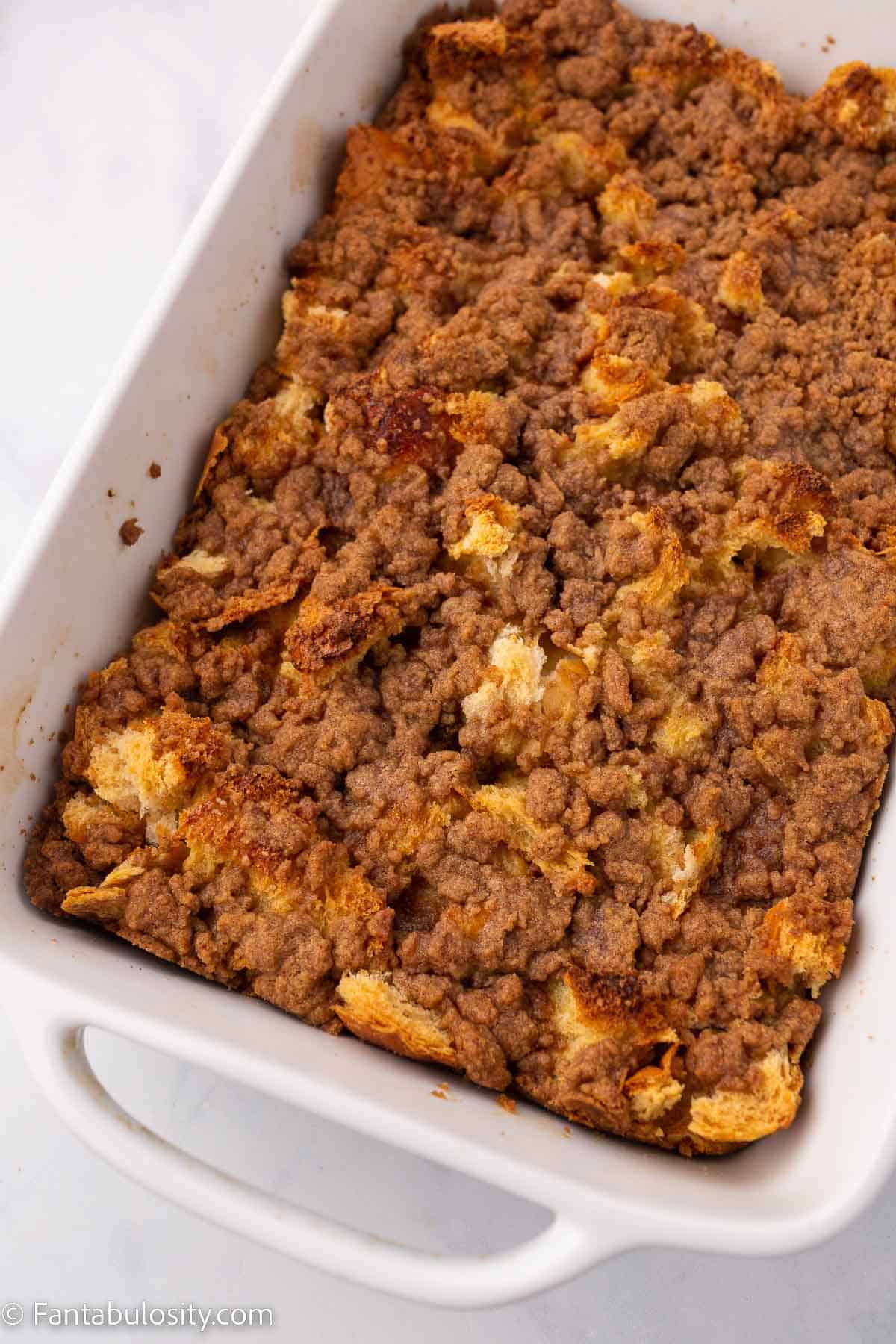 Baked french toast casserole in white baking dish.