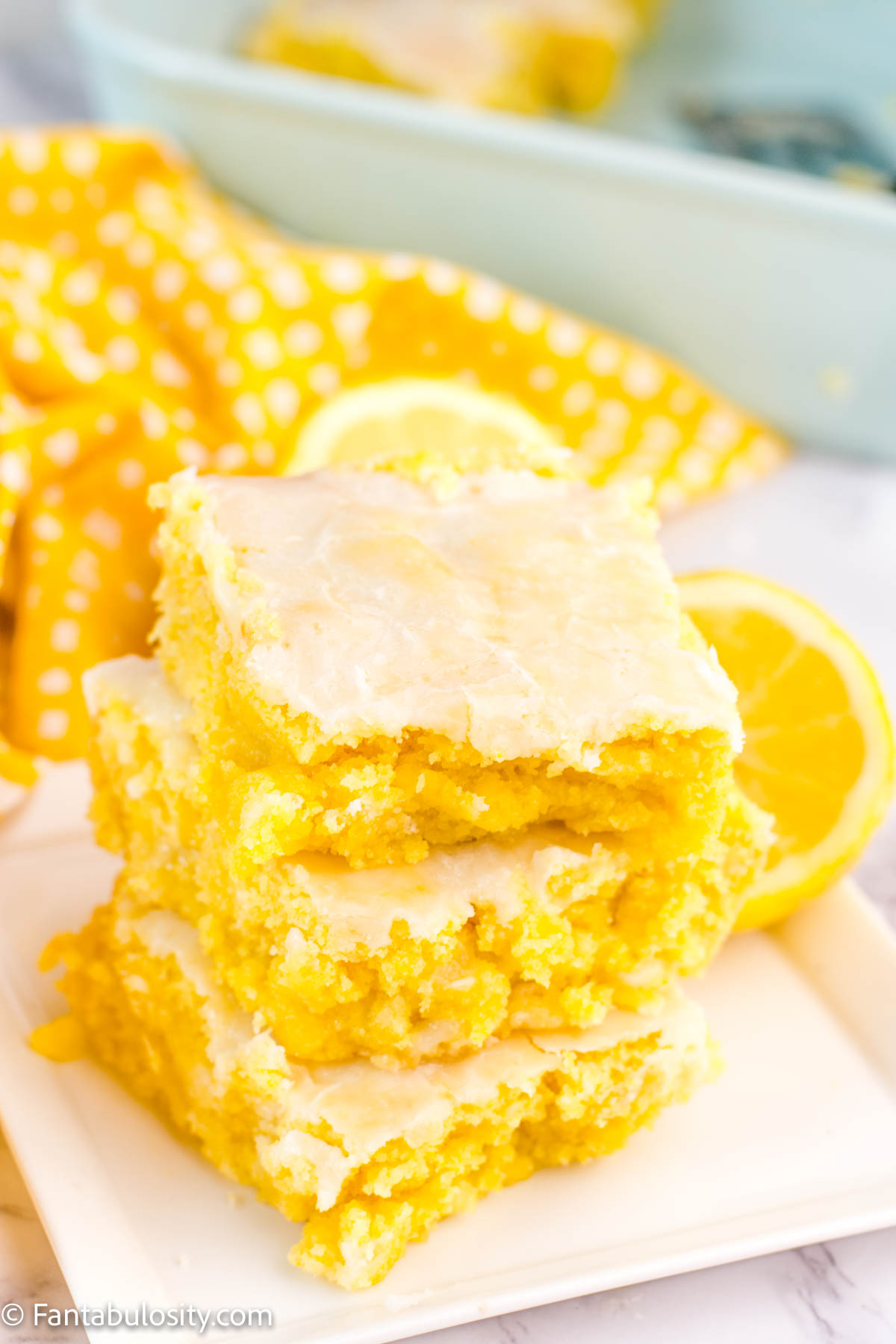 Lemon Brownies Stacked on white plate