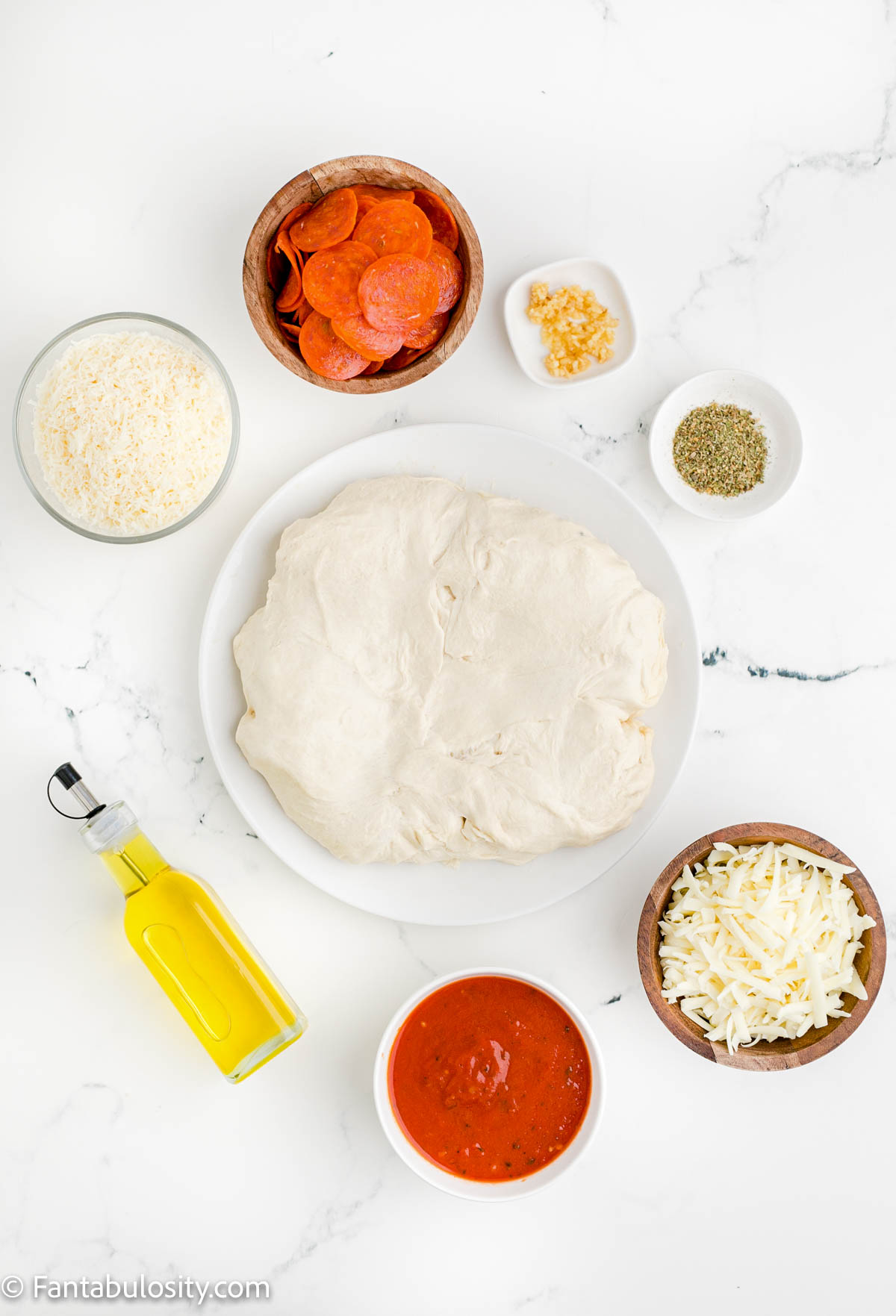 Ingredients on table for pizza bread