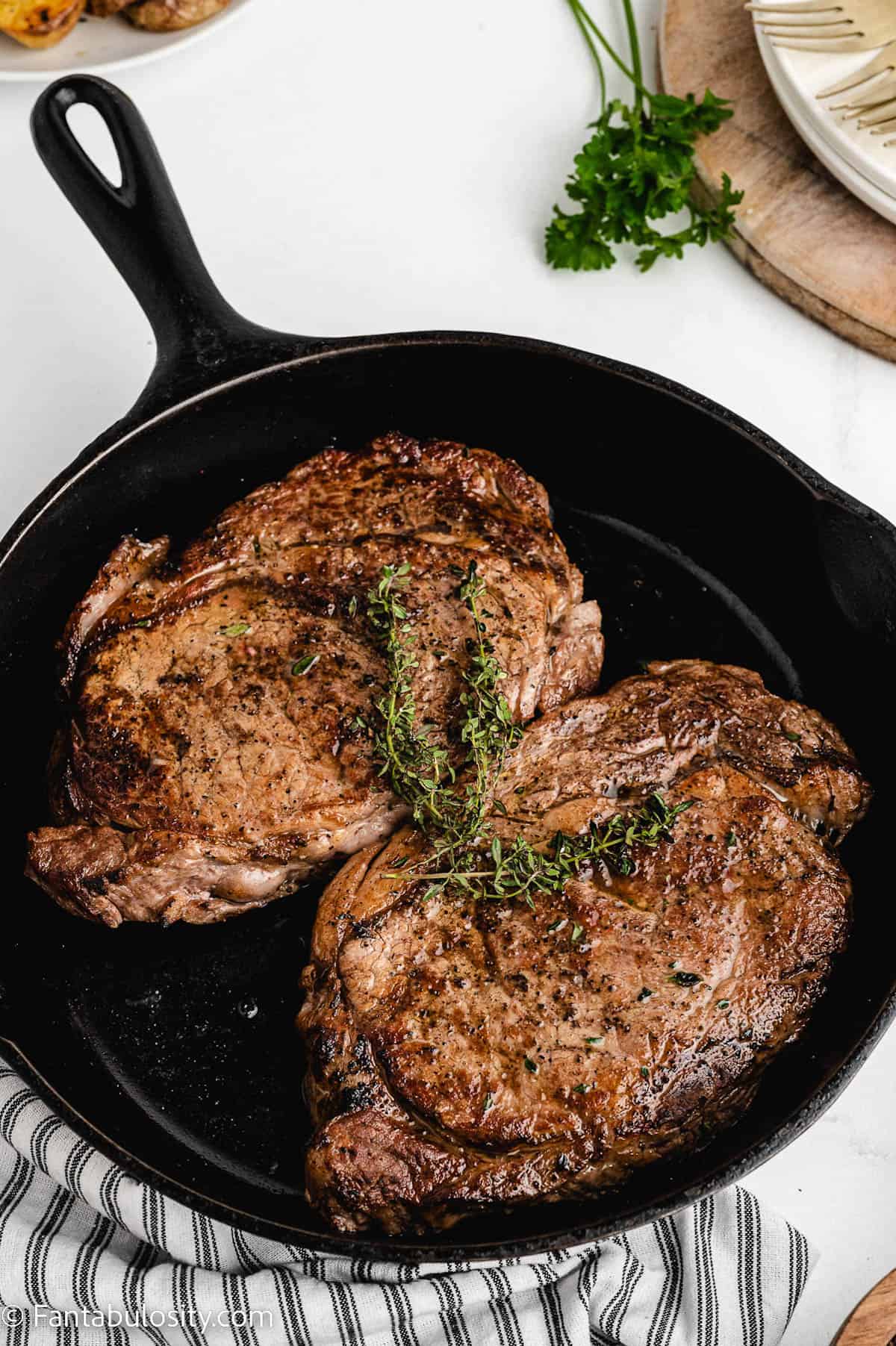 Baked steak in cast iron skillet