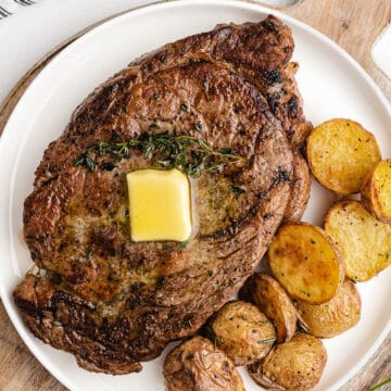 Oven Baked Steak with Butter and a side of potatoes