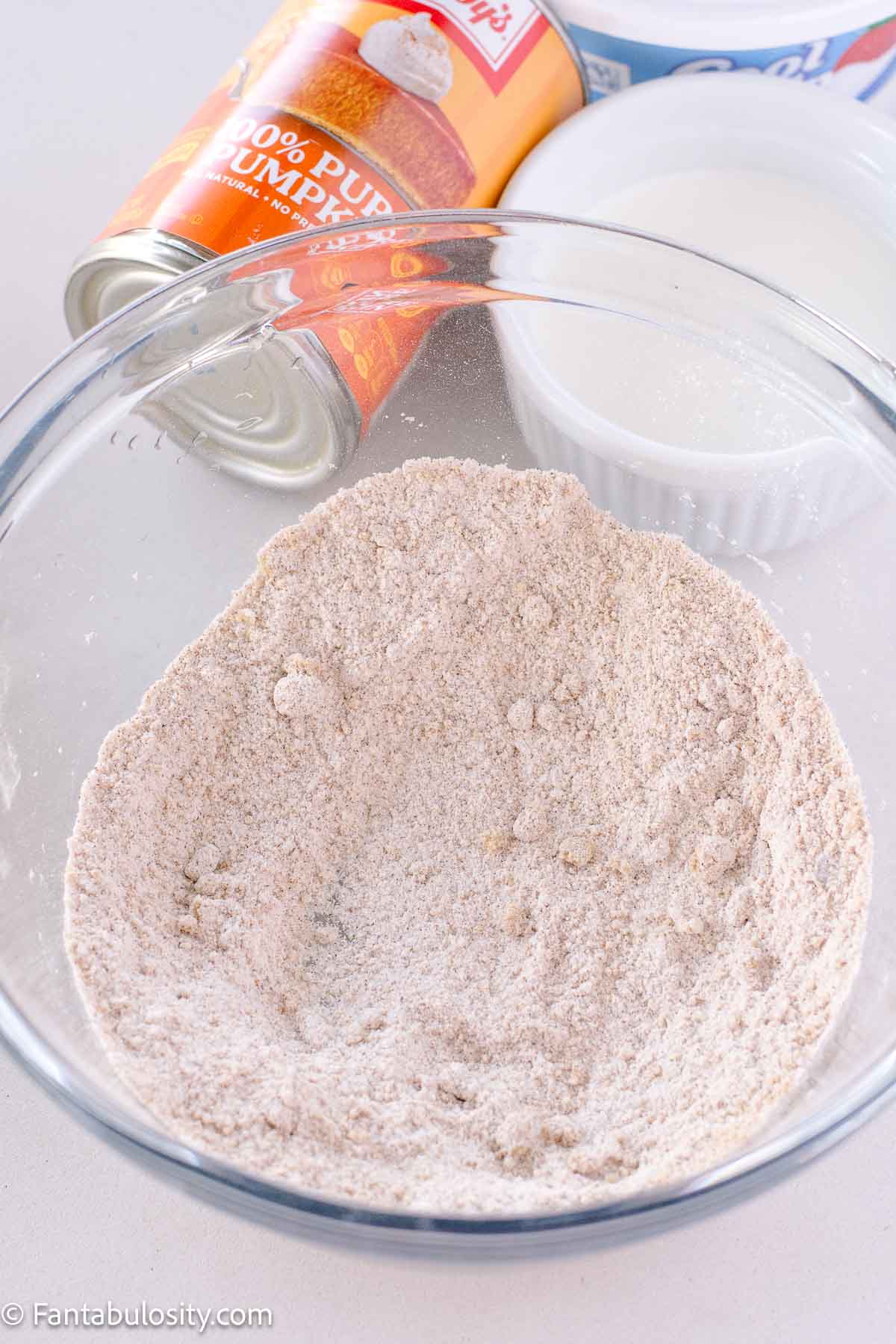 Vanilla pudding mix, pumpkin pie spice and brown sugar mixed together in mixing bowl.