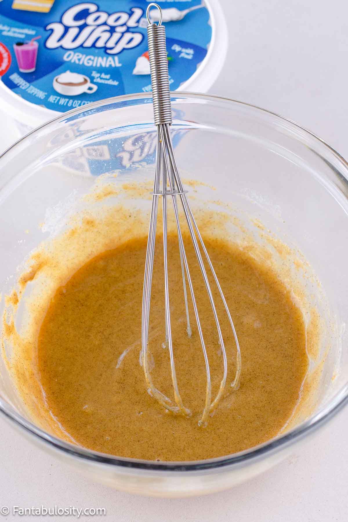 Half and half added to dry ingredients mixture in mixing bowl.