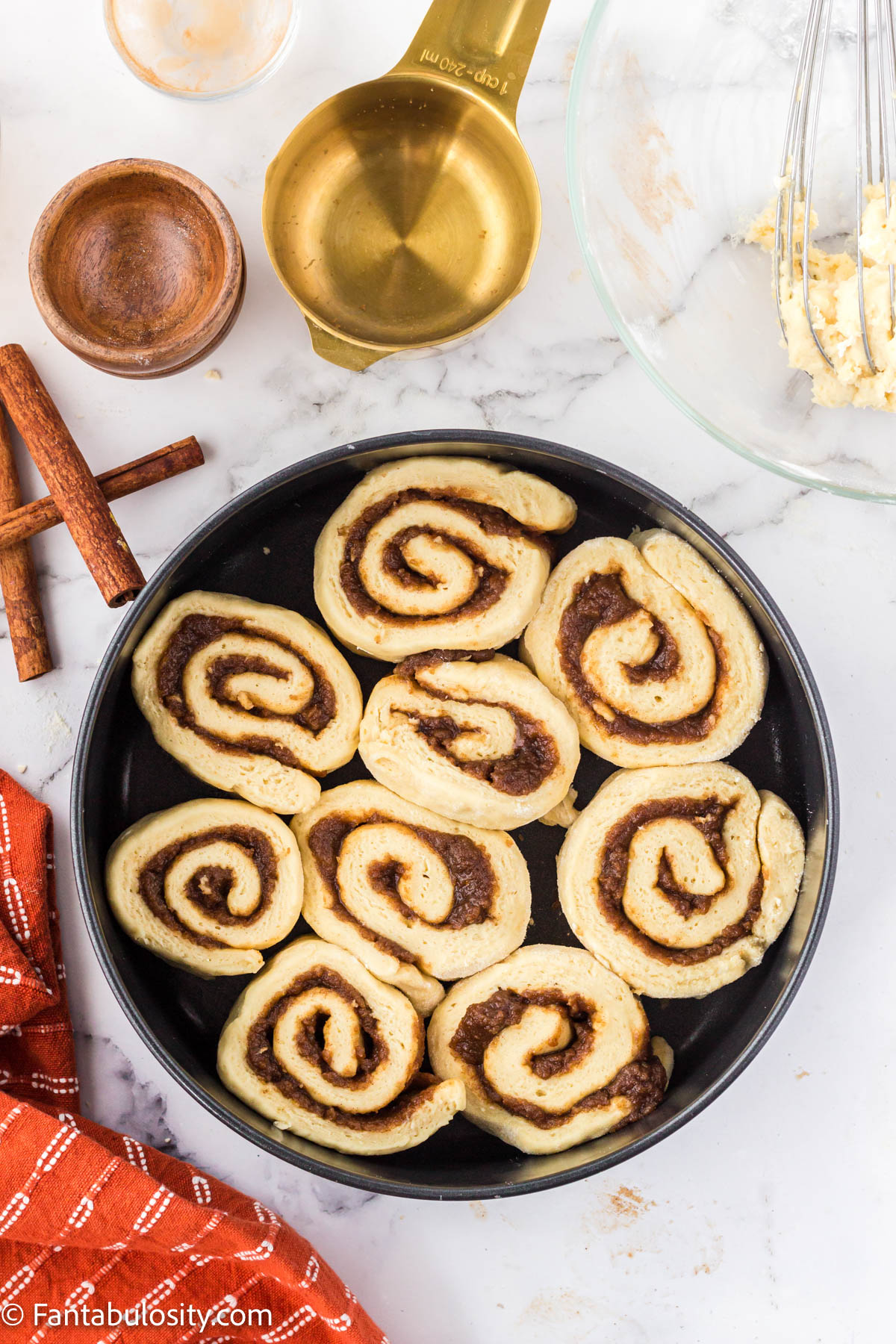 Roll cinnamon rolls in to tube shape and slice