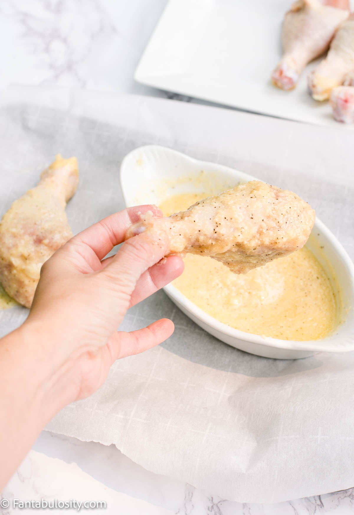 Fully cover chicken leg with garlic butter batter