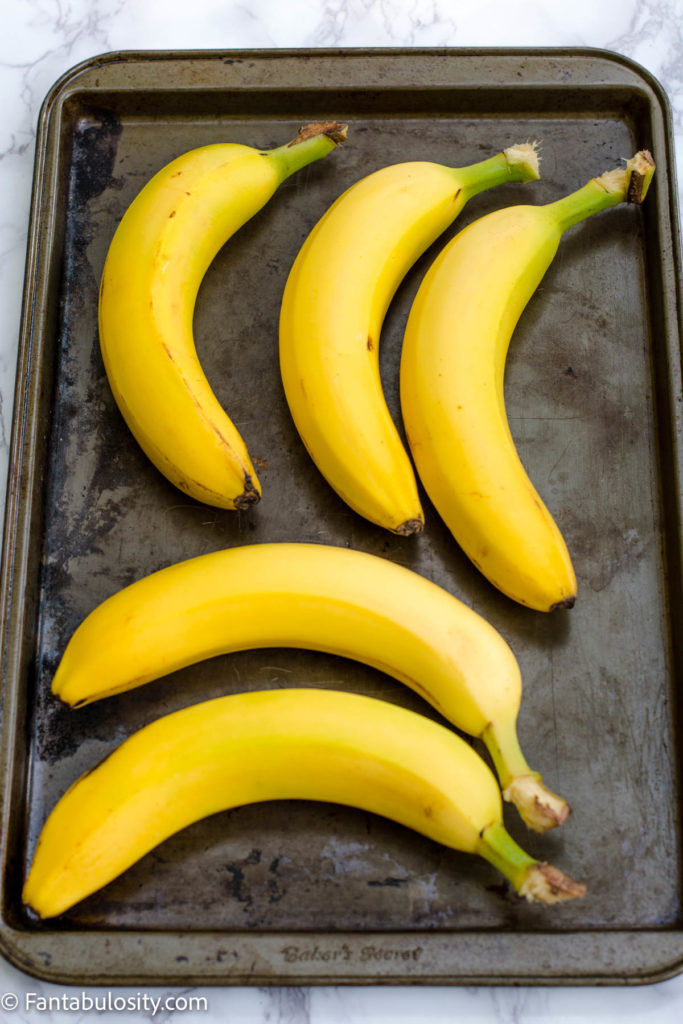 raw bananas on baking sheet