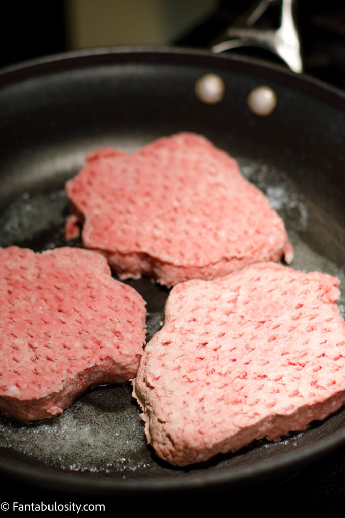 Place burger patties in pan on stove