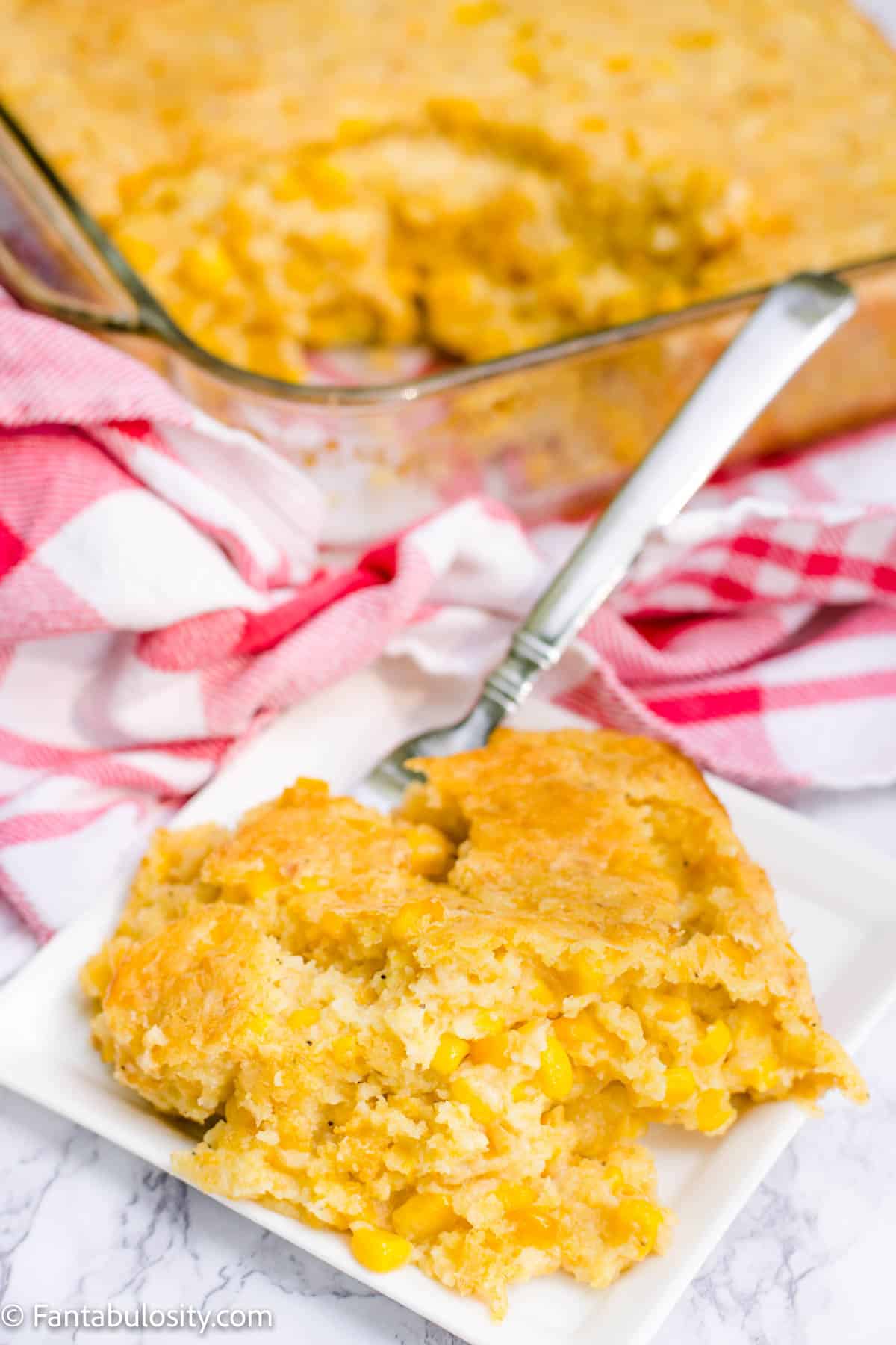Easy corn casserole recipe on plate with fork