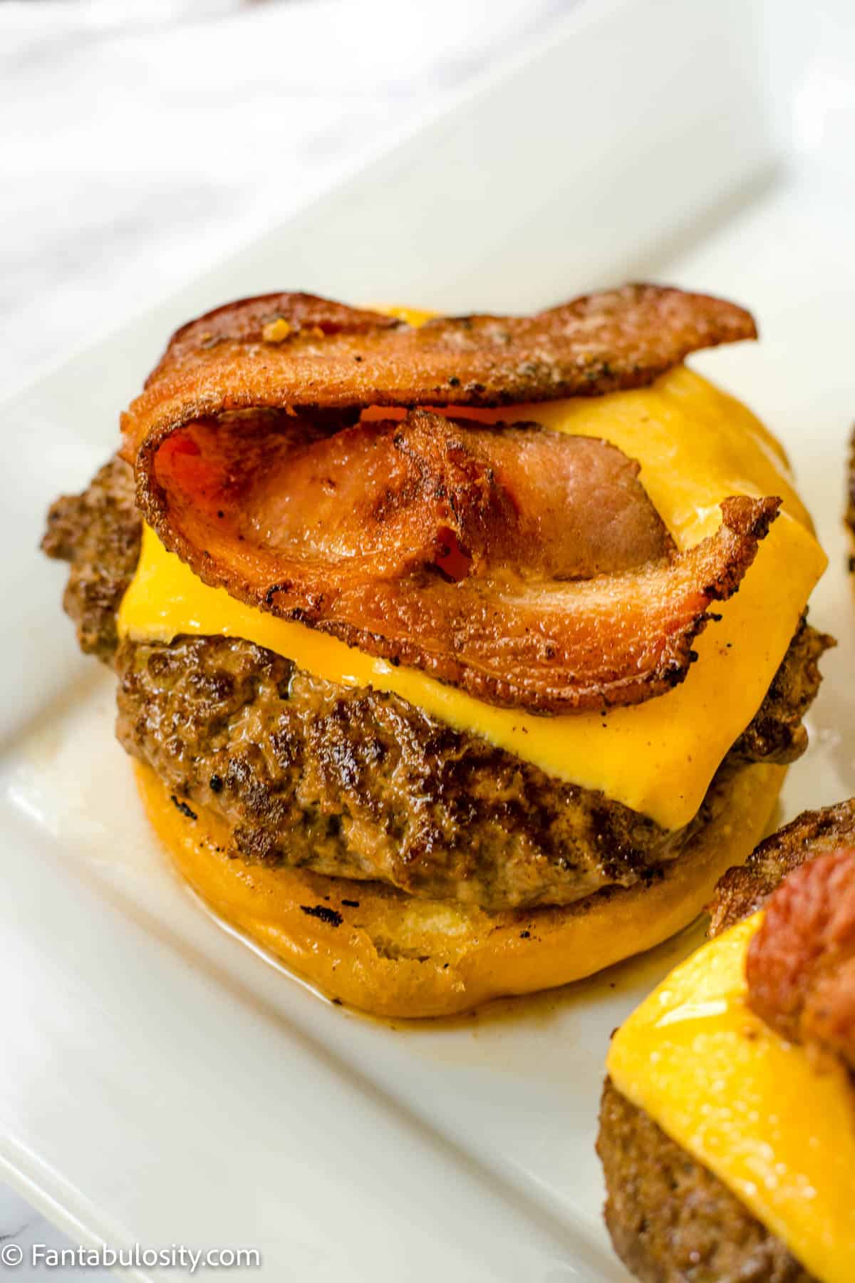 Cheeseburgers with bacon on donuts