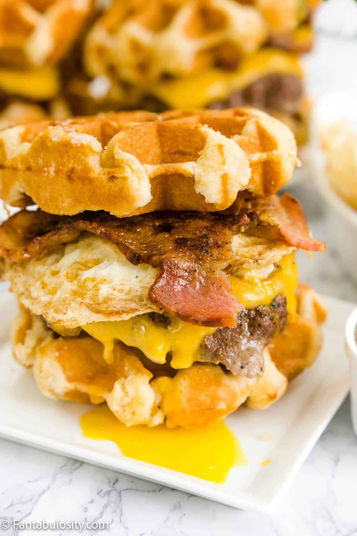 Close up image of waffle buns on cheeseburger