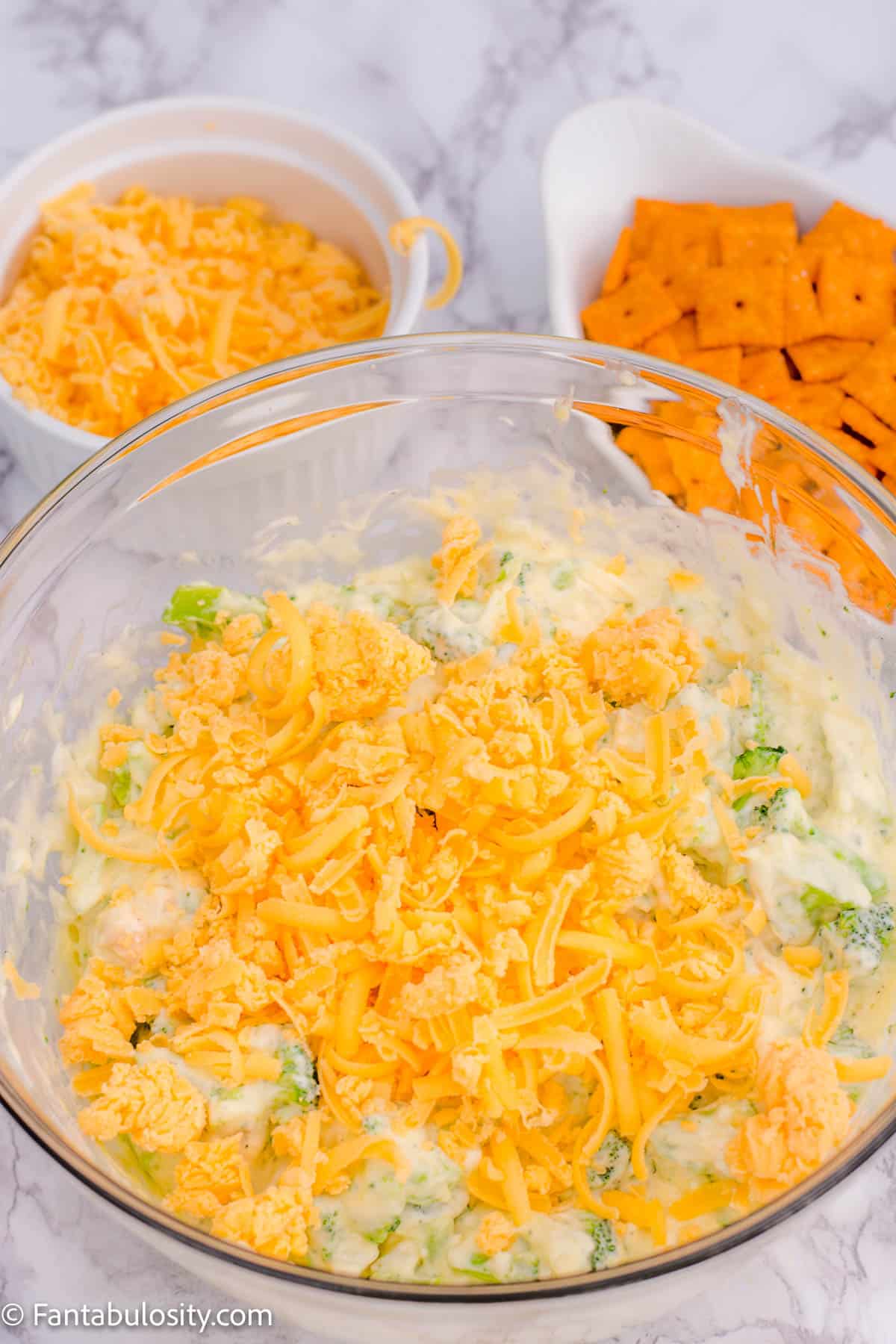 shredded cheese in broccoli mixture