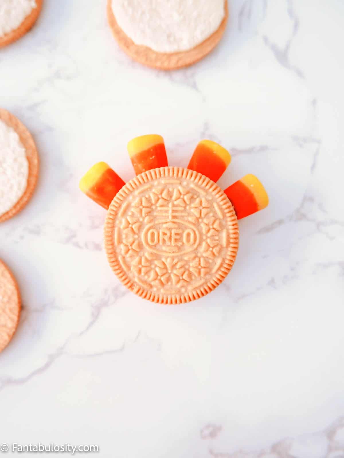 Attach the other half of the Golden Oreo to your cookie using the melted chocolate.