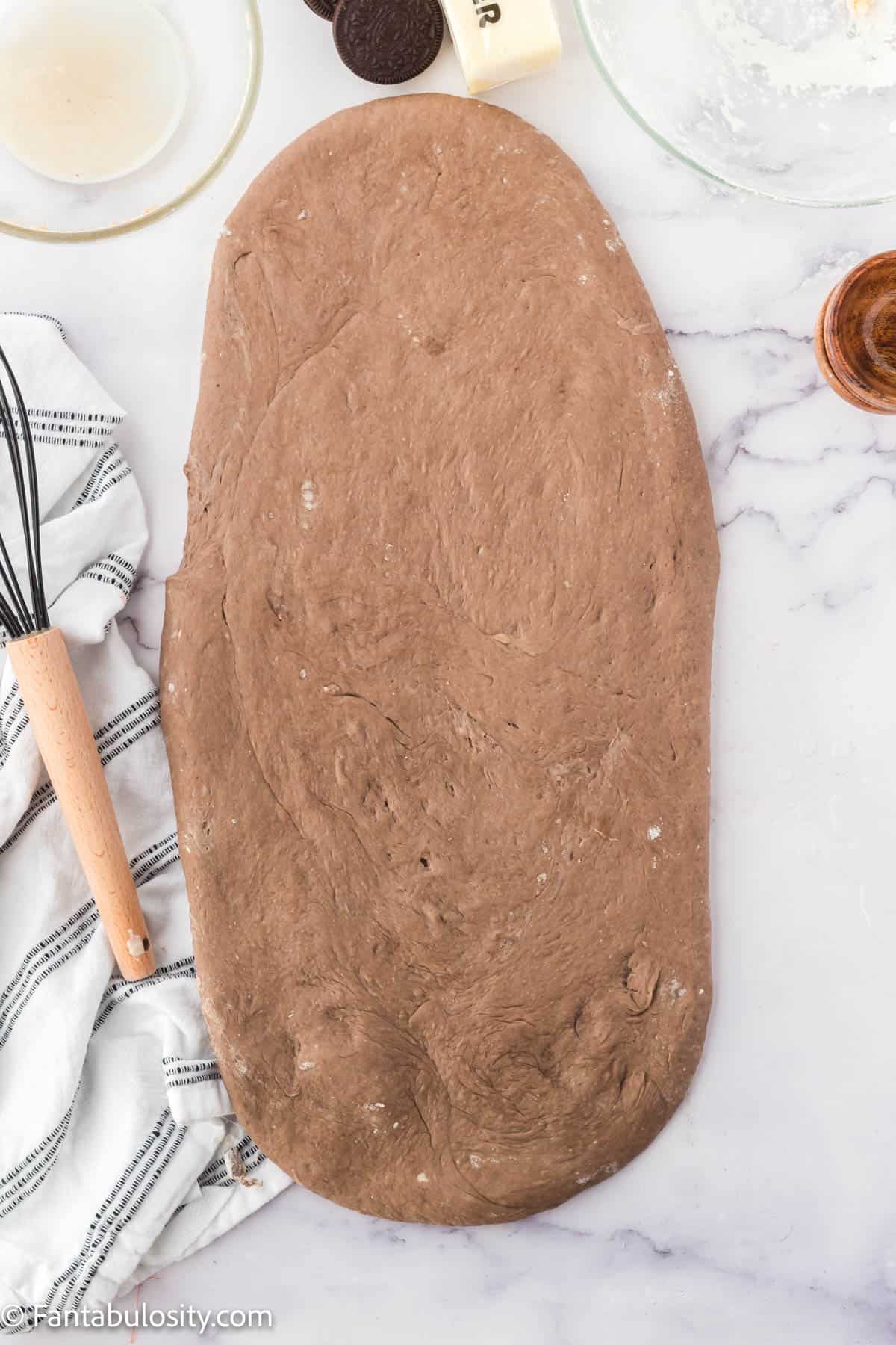 After resting, roll dough out into a large rectangle.