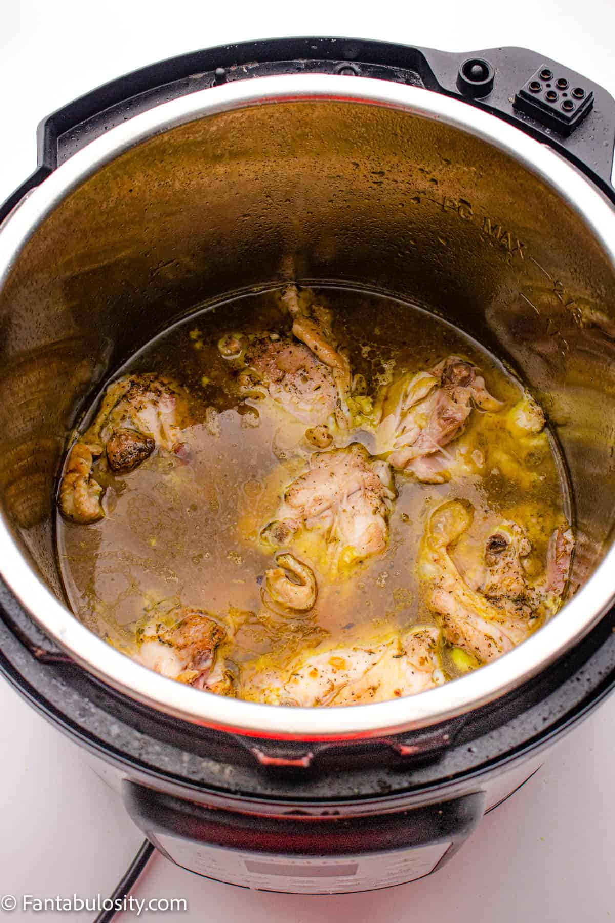 Add chicken stock to the Instant Pot.
